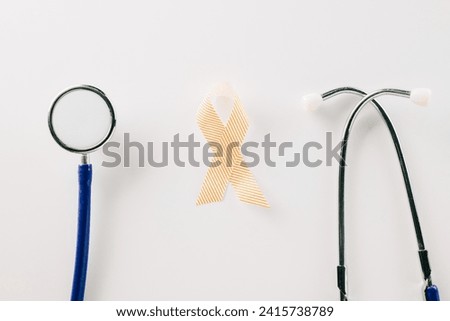 Pink awareness ribbon sign and stethoscope of International World Cancer Day campaign month isolated on white background with copy space, concept of medical and health care support, 4 February