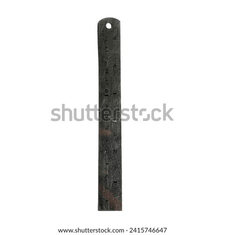 A silver iron ruler with a length of 15 centimeters is isolated on a white background