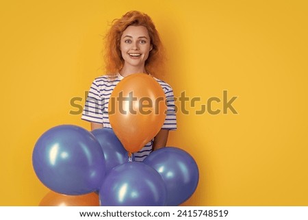happy woman hold party balloons in studio, copy space. woman with balloon for party