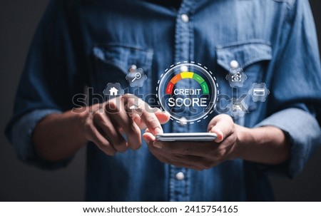Credit score concept, Person use smartphone with virtual credit score icon for chart with credit history values. Online credit score ranking check. student loan, mortgage and payment cards. Royalty-Free Stock Photo #2415754165