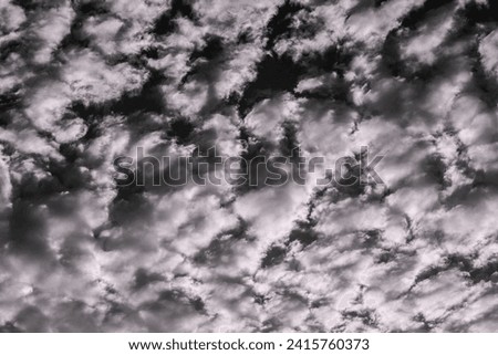 Captivating aerial view of dramatic black n white cloud formations, showcasing mesmerizing styles, shapes, and textures. Fit for visuals Storytelling.