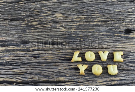 An image of Love You on wooden background
