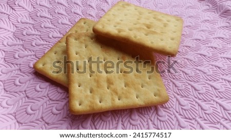 this is a picture of a biscuit in a pink background