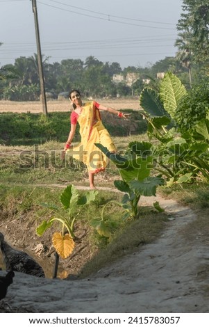 Indian rural girl smiling and enjoying nature. Freedom concept.