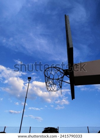 basketball hoop with a blue sky background 