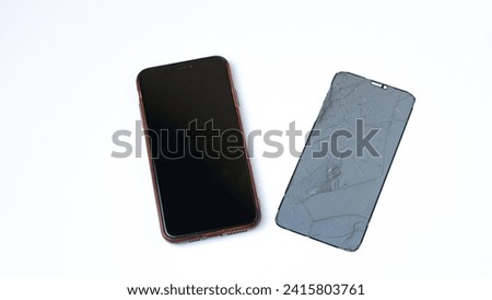 photo of smartphone with broken touchscreen display on white background