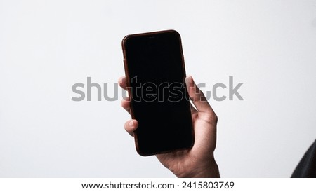 man holding smartphone with on white background. Space for text