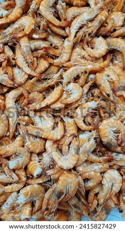 Chilled boiled shrimp in a supermarket or grocery store, close-up. Seafood