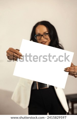 Eyeglasses businesswoman pose promote mockup template, selective focus. Confident business lady showing white empty space blank at camera, blank paper in hand. Advertising concept. Copy ad text space