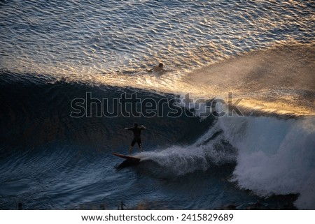 Surfing picture captured in Maui, Hawaii. 