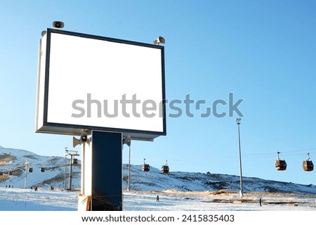 Blank billboard mockup for advertising, at the mountain ski resort .