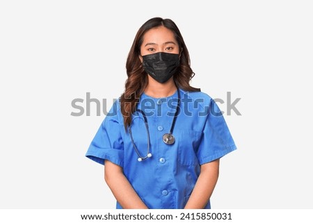 Masked young chinese female nurse.