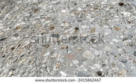 inclusions of granite chips in concrete, the texture of concrete, horizontal design on cement and concrete texture for pattern and background