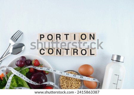 Portion Control Concept Background Wooden Block Letters Royalty-Free Stock Photo #2415863387
