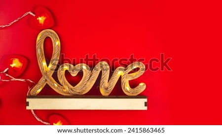 Valentine's day and holiday background. The word Love on a red background
