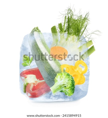 Frozen food. Raw vegetables in ice cube isolated on white