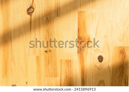 abstract gray shadow background on wooden floor texture, shade with sunlight.