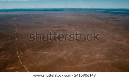 Aerial photo of a road through the Arizona desert         