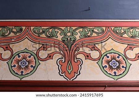 Colorful neo-Gothic wall painting in green, red and blue