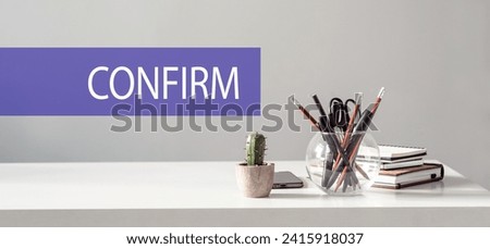 Confirm word written on a violet strip on office desk background