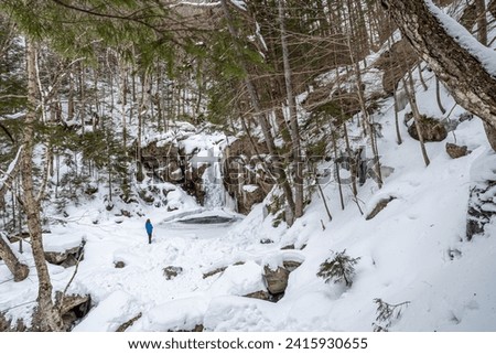 Hiker in Franconia Notch State Park . New Hampshire mountains. USA Royalty-Free Stock Photo #2415930655