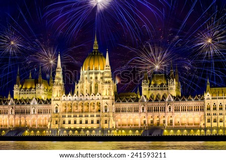 Fireworks over  Hungarian parliament in Budapest. New years eve in Budapest, Hungary.  Royalty-Free Stock Photo #241593211