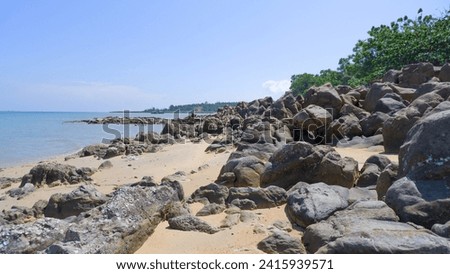 Natural Views Of Tropical Beaches In Summer With Stretches Of Rocks Along The Coastline Of Tanjung Kalian, Indonesia