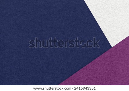 Texture of craft navy blue color paper background with white and purple border. Vintage abstract cardboard. Presentation template and mockup with copy space. Felt backdrop closeup.