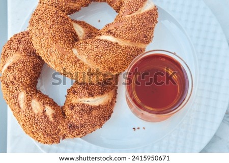 Traditional Turkish breakfast. National food, Turkish tea and semite bun. Royalty-Free Stock Photo #2415950671