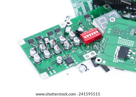 Heap of PCBs and electronic components isolated on white background