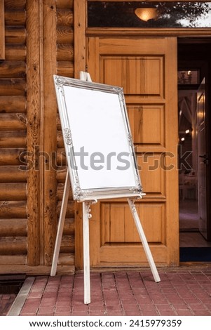 Empty canvas easel on wooden legs