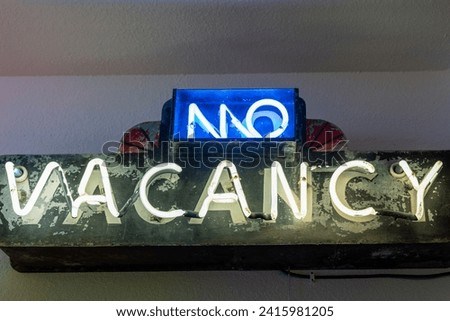 No Vacancy neon sign, lit up in yellow and blue neon