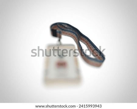 Blurred photo of name tag with white background