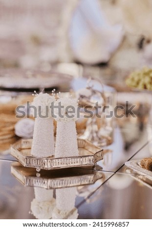 Persian Sofreh aghd kaleh ghand sugar cone decor at a traditional wedding stock photo