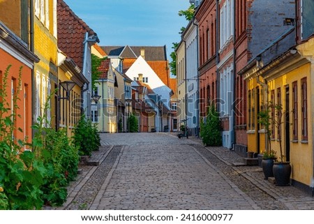 Medieval street in the old town of Odense, Denmark. Royalty-Free Stock Photo #2416000977