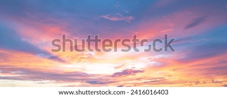 Sunrise background. Dramatic sunset background. Sky with clouds in Sunrise sky light background. Sunrise with clouds in various shapes background. Calm Sunrise. Royalty-Free Stock Photo #2416016403