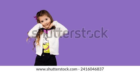 The picture used for the banner or for an advertisement with a very beautiful little girl, the little girl is a model and a very attractive person, she has beautiful hair and a very contagious smile.