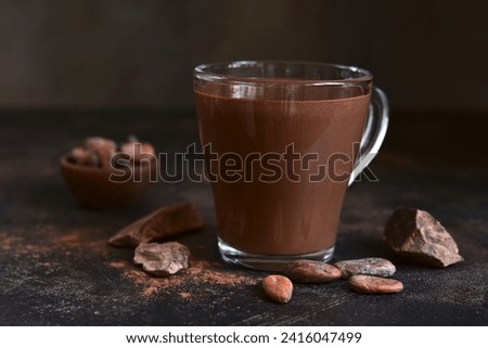 Hot chocolate with winter spices in a glass cup.