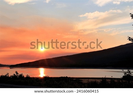 sunset at lake in glacier national park