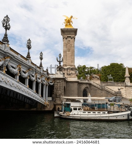 Alexander III Bridge, Beaux Arts style, crosses the Seine River as it passes through Paris and connects the Esplanade des Invalides with the Grand Palais and the Petit Palais, Paris, France Royalty-Free Stock Photo #2416064681