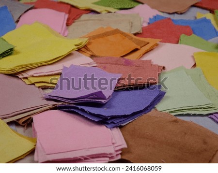 Set of multicolored fabrics of homemade dyeing for patchwork, background
