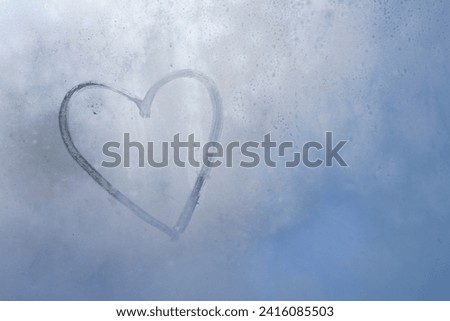Heart Drawn on Frozen Glass