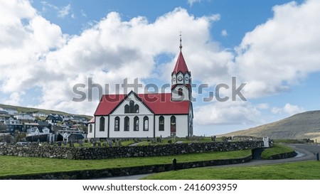 Sandavagur village church in Faroe Islands, a place of tradition, where baptisms, weddings, and Sunday services gather the village people Royalty-Free Stock Photo #2416093959
