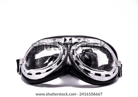 Black Retro Vintage Leathern Goggles for Motorcyclist on Black Background Royalty-Free Stock Photo #2416106667