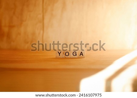 Wooden sign yoga classes with grainy gradients and vibrant light