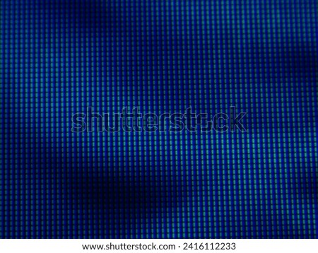 Pixellated background texture of screen and blue tones for use in backgrounds and wraps. Square rectangles of LED lights.