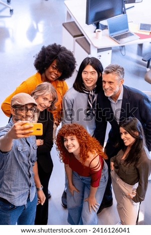 Diverse business people taking a selfie together in the office. Business and technology concept.