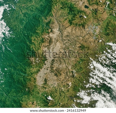 Three Decades of Urban Expansion in Quito. In the past three decades, Quitos urban area has more than quadrupled. Elements of this image furnished by NASA. Royalty-Free Stock Photo #2416132949