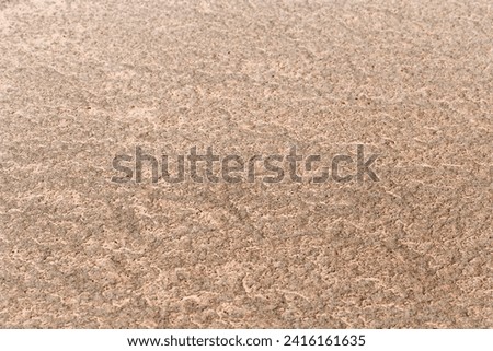 Sand texture surface. Close up top view of sand on shore salt lake, neutral color, minimal nature aesthetics backdrops. Sandy abstract macro background. Selective focus, Above view, nature pattern