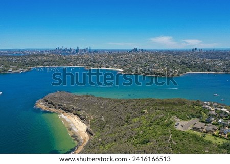 Beautiful high angle aerial drone view of Balmoral Beach and Edwards Beach in the suburb of Mosman, Sydney, NSW, Australia. CBD, North Sydney and Chatswood in the background, Grotto Point